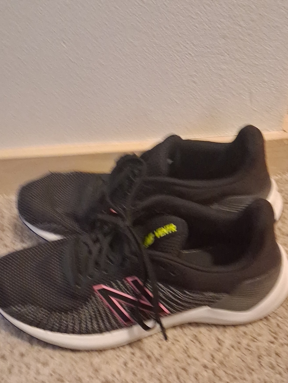 Nike Women’s Black Athletic Sneakers with Pink Logo